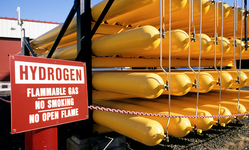 Yellow hydrogen bottles on a rack